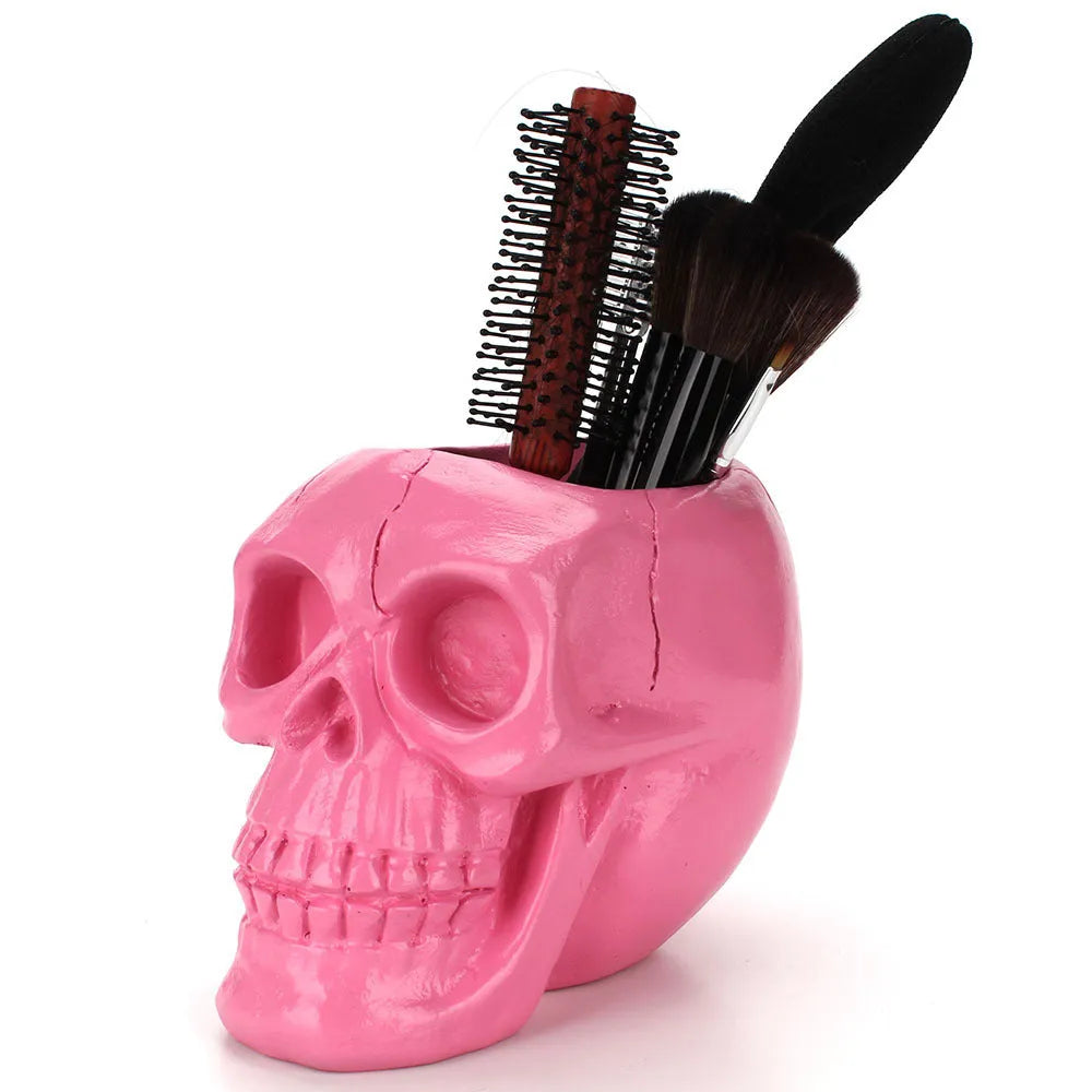 Skull head resin storage tube in black, 11x15x11cm, with open top showing inner 7cm diameter for storing beauty tools