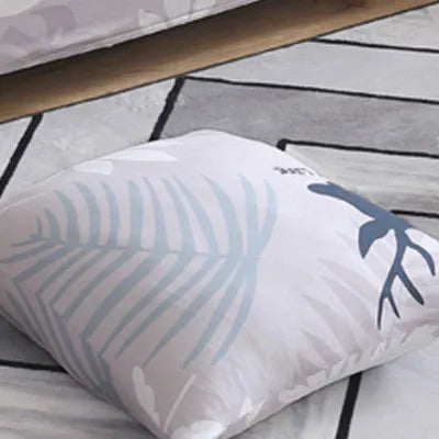 Geometric print polyester sofa slipcover stretched over sofa with matching pillowcase