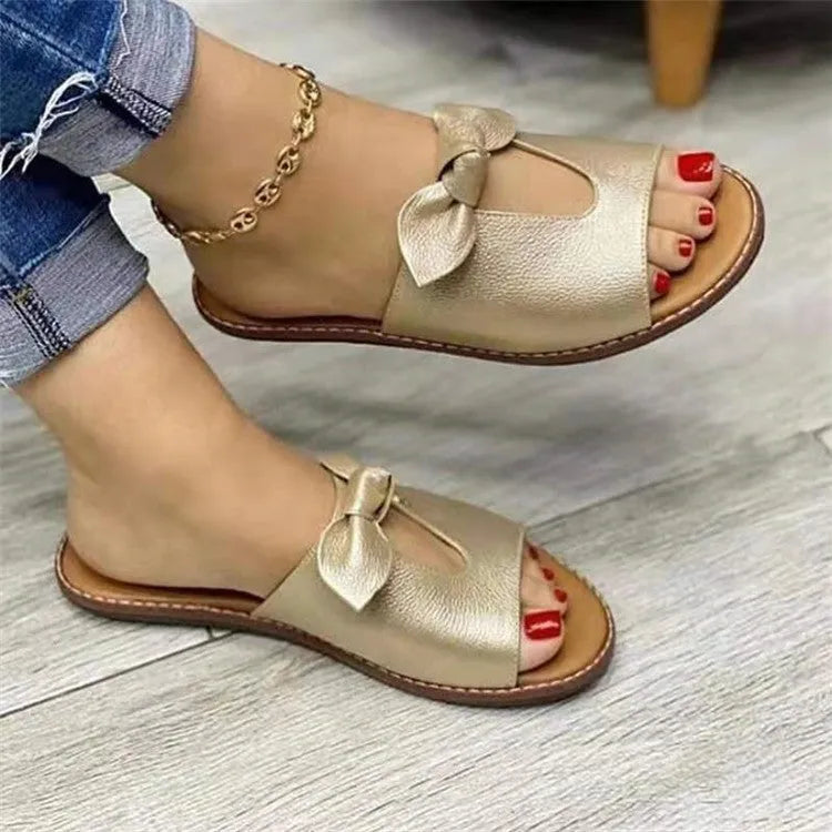 Ladies casual sandals with bow decoration and fish mouth design in black, pink, and gold colours