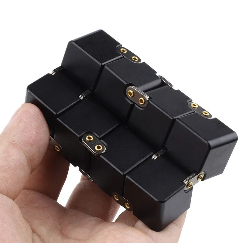 Zinc alloy infinity cube fidget toy in black, measuring 4cm, on a white background