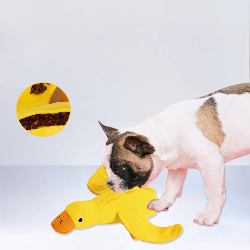 Yellow teddy dog toy with integrated duck doll, a pet training aid with sound and treat dispenser.