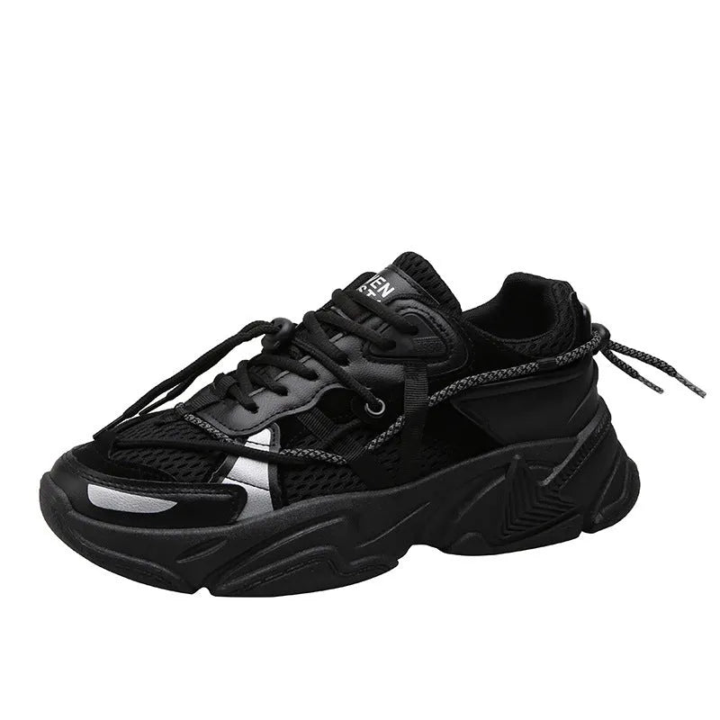 Men's black platform dad shoes with white soles and lace-up front, shown on a grey background.