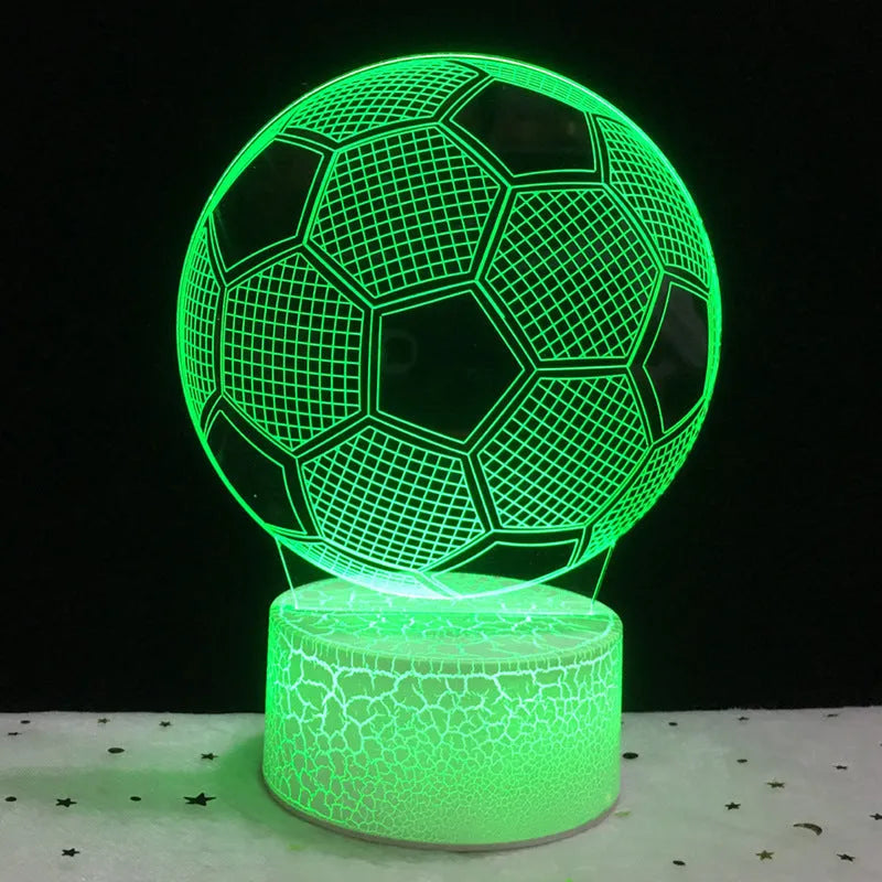 3D football-shaped LED night light showing colour gradient on acrylic panel with touch control base.