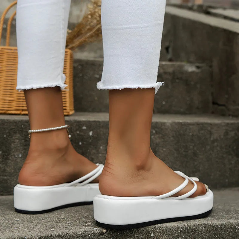 Thick bottom herringbone pattern flip-flops in multiple colours on a white background