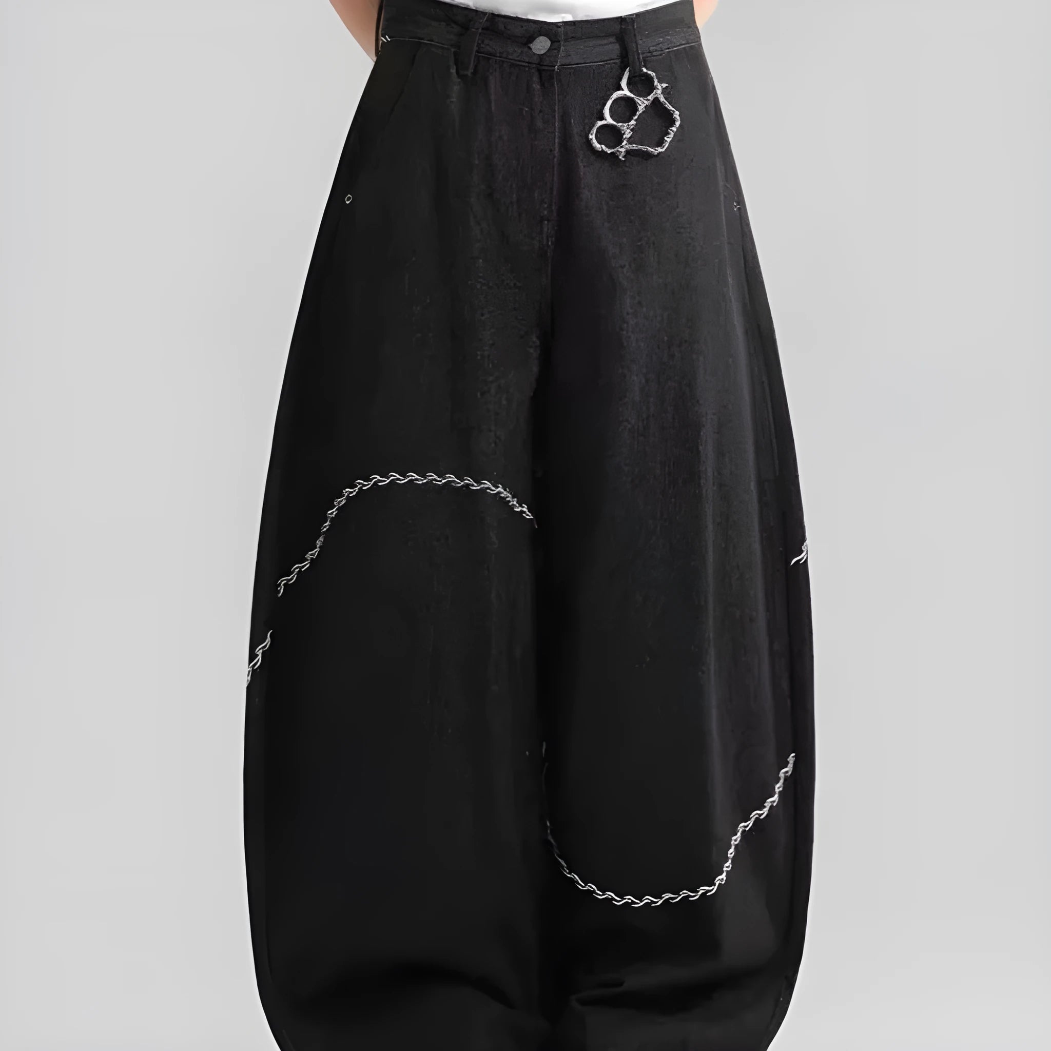 Black straight-leg denim trousers with a mid waist and zip fly, laid flat.
