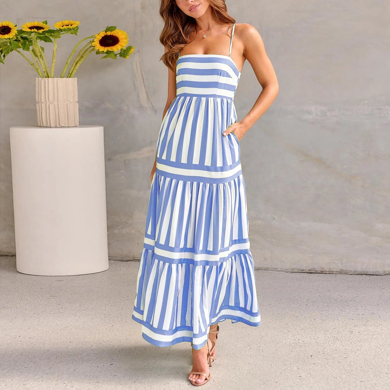 Women's long striped summer dress with suspenders, a square neckline, backless design, and side pockets.