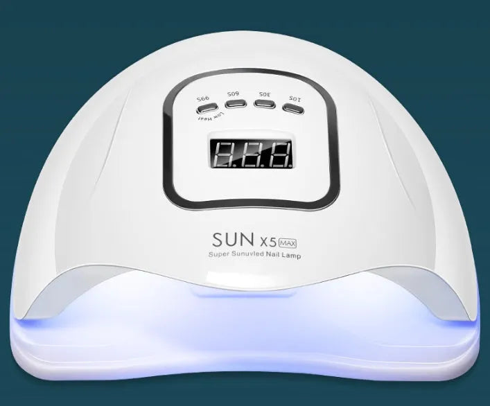 White nail polish dryer lamp with UV and LED light beads and digital timer display.