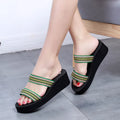 Brown women's bohemian slippers with wedge heel and adjustable cross-strap.