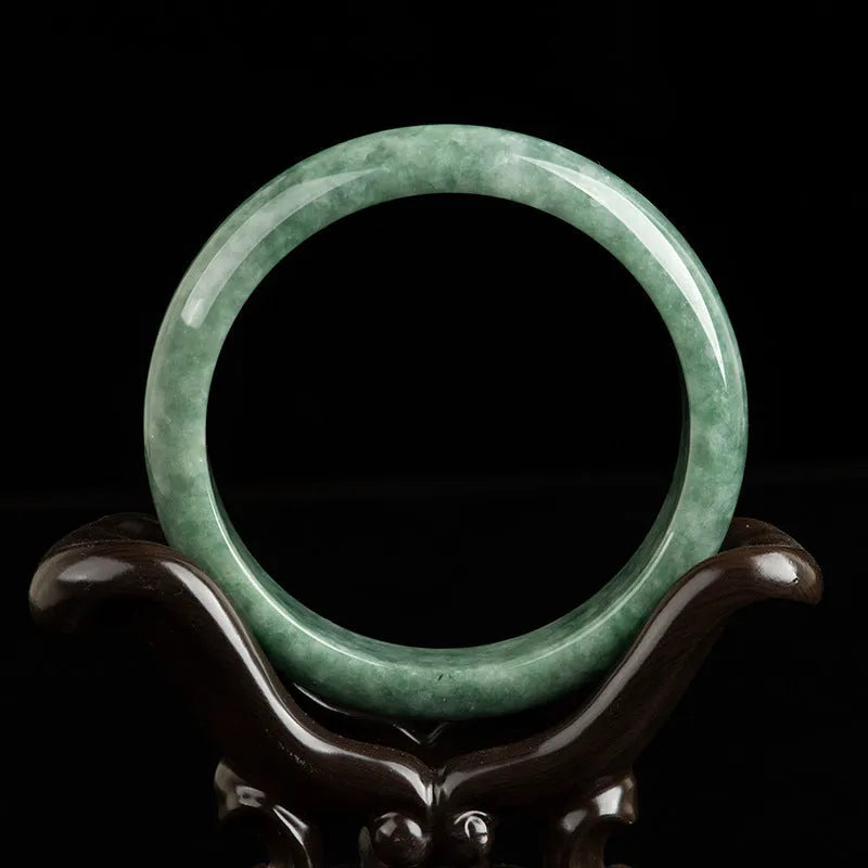 Deep pea green jade bracelet for women on a gift box, with certificate.