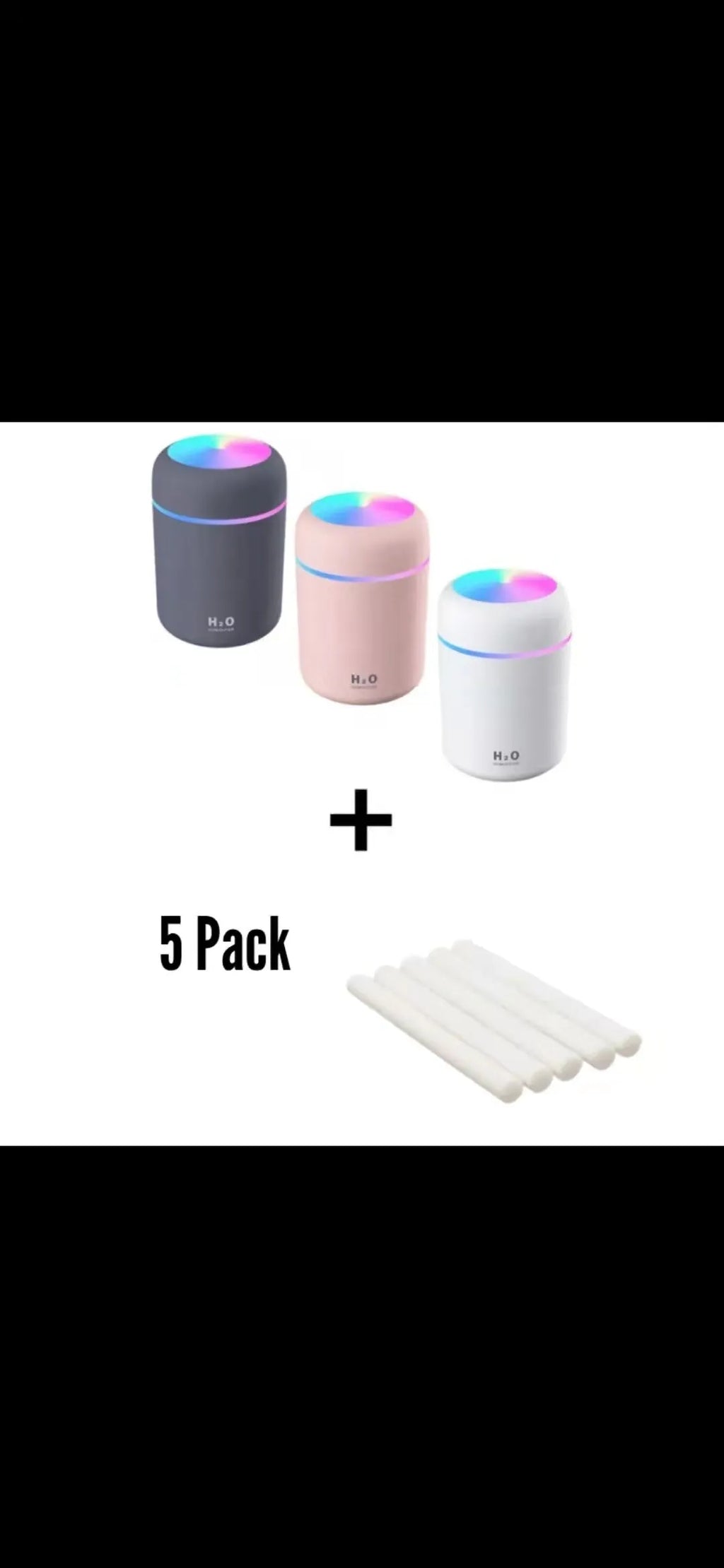 Pink USB portable humidifier with 300ml water tank on wooden desk surface