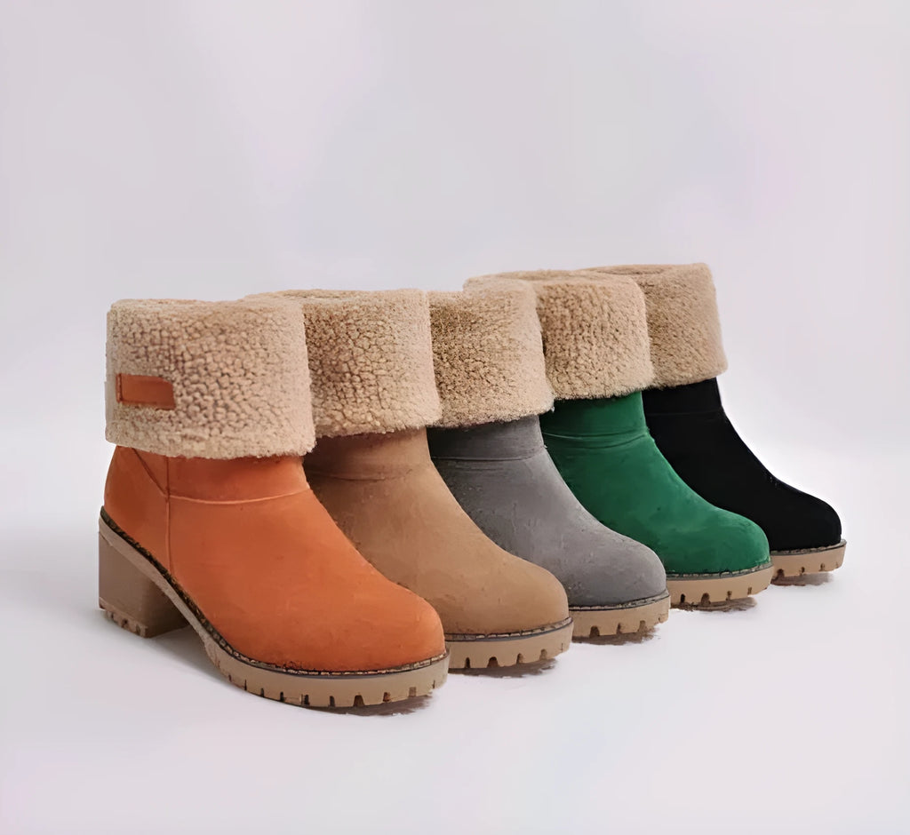 Women's suede mid-calf snow boots with a thick low heel and round toe in various colours.