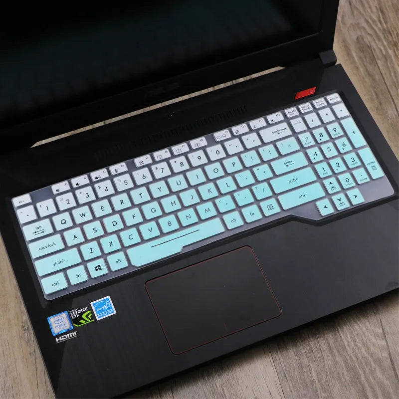 Transparent silicone keyboard protective film for ASUS Flight laptop on a keyboard.