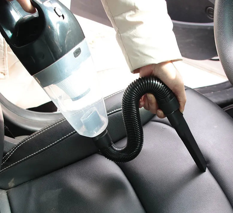 12V handheld car vacuum cleaner in orange, black, or blue with multiple nozzles and a long power cable.