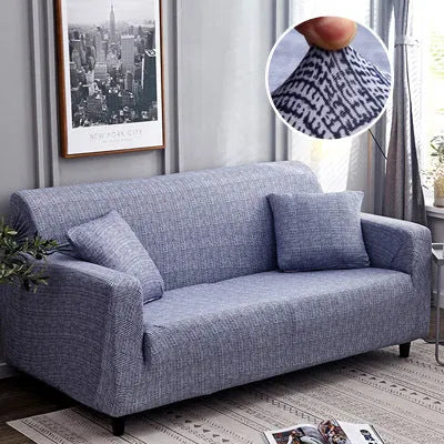 Geometric print polyester sofa slipcover stretched over sofa with matching pillowcase