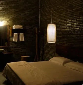 Southeast Asian woven bamboo plait wall lamp with E27 light fitting