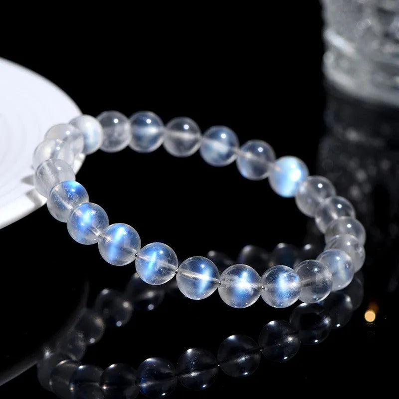 Natural cream crystal bracelet with blue moonlight design and polished beads