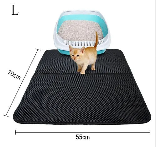 Double layer EVA cat litter mat in black with textured surface, placed under a litter box to trap debris