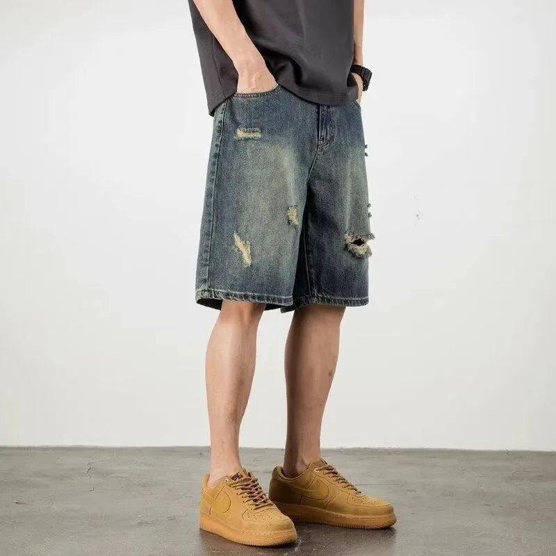 Blue men's denim shorts with a retro loose hole design and straight-leg cut.