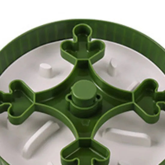 Grey rotating pet slow feeder bowl with a blue silicone windmill-pattern licking mat attached.