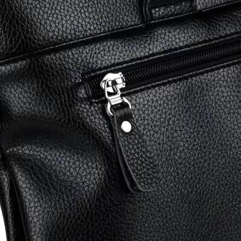 Men's black PU leather messenger bag with crossbody strap and splicing design