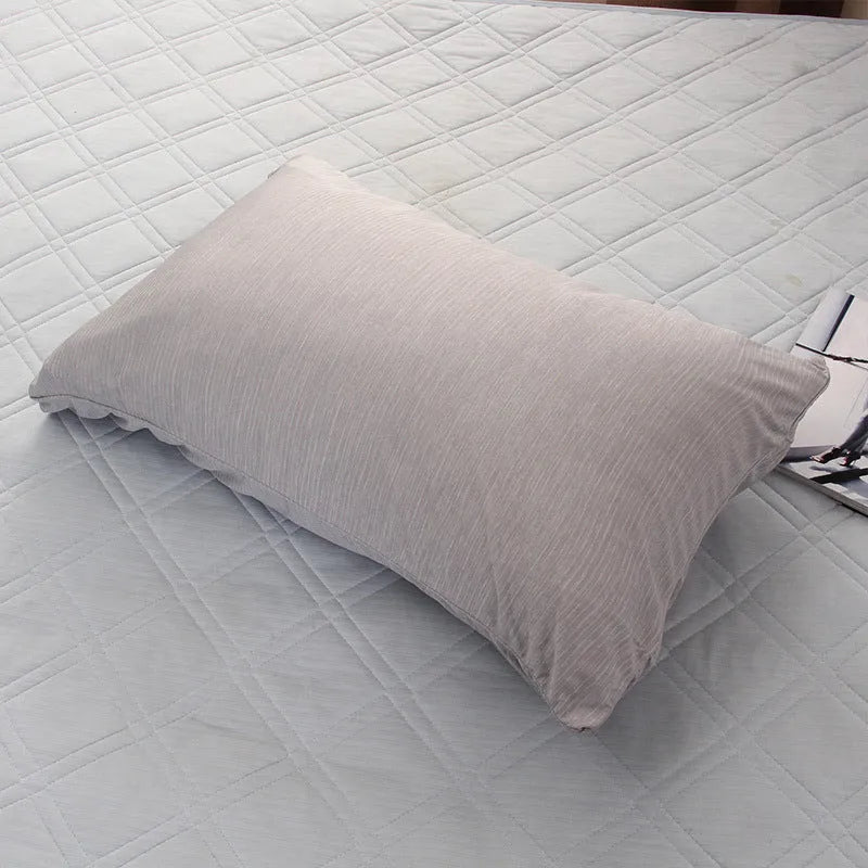 Blue Japanese cooling blanket with Q-Max fibres laid flat on a bed.