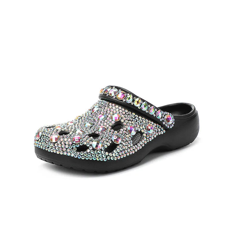 Black women's platform sandals with rhinestones around holes and a textured EVA sole.