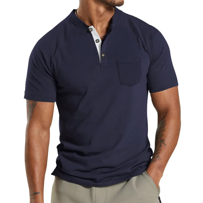 Plus size man wearing a light grey short sleeve casual shirt with a button chest pocket.