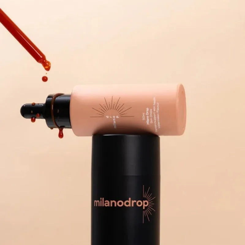 Self-tanning set showing 50ml tanning drops bottle and 75ml tanning glitter cream tube with black essence.