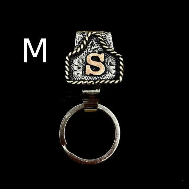 Handmade metal cow tag key holder for belts in assorted colours on a leather strap