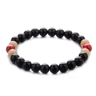 Natural lava stone beaded bracelet for essential oils, ethnic style, on a white background.