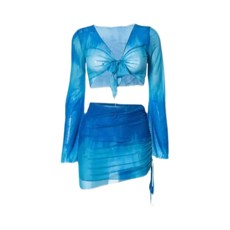 Women's blue high waist swimsuit four-piece set with shirt, bra, underwear, and skirt on beach