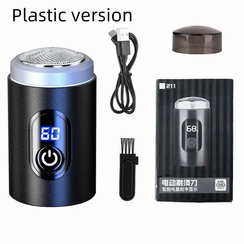 Black mini rechargeable shaver with USB cable and cleaning brush on a table