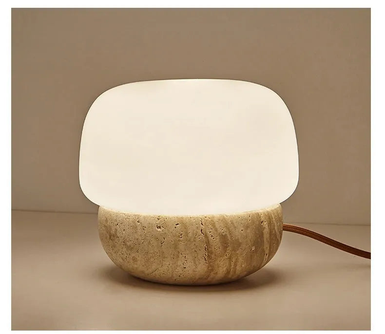 Cream coloured retro bedside lamp measuring 18x17cm with button switch and warm bulb illumination