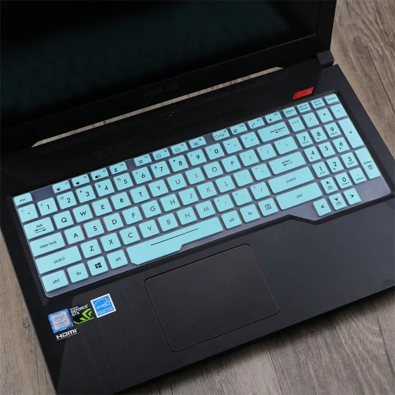 Transparent silicone keyboard protective film for ASUS Flight laptop on a keyboard.