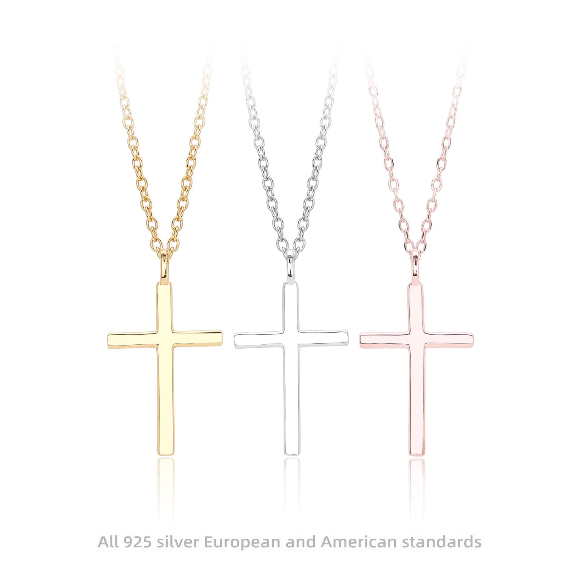 Sterling silver cross necklace with O-shaped chain in gold plating on display
