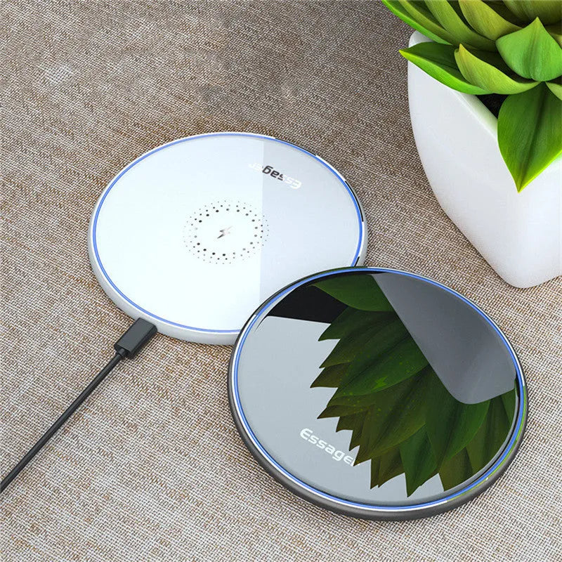 Black and white aluminium wireless charger showing LED indicator lights and anti-slip surface