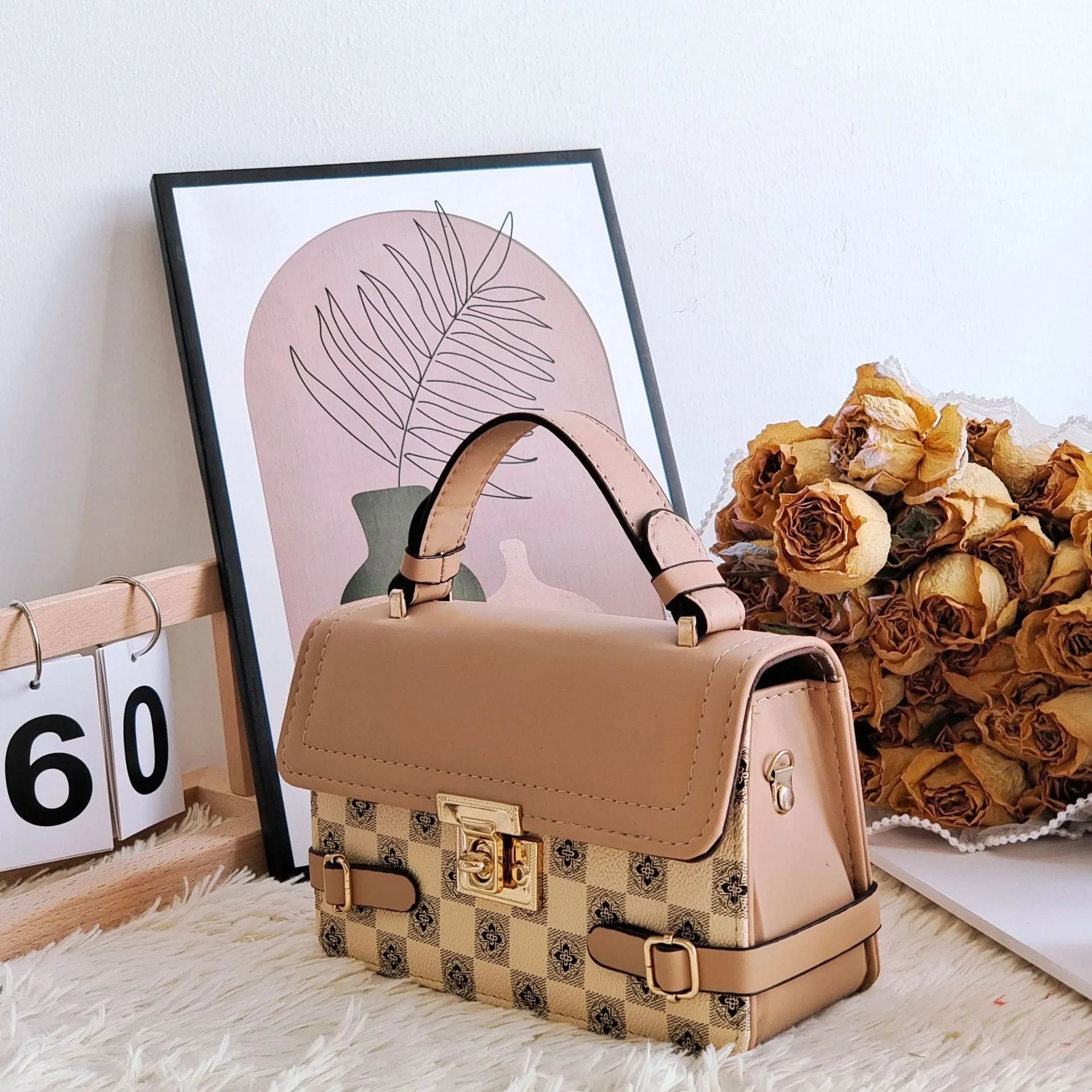 Retro-style square crossbody bag with floral stitching and a diamond pattern in PU leather.