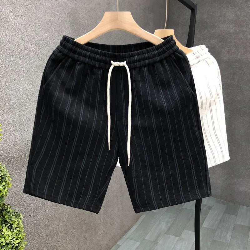 Men's black and white striped fleece-lined casual shorts showing double-layer waistband and straight-leg cut