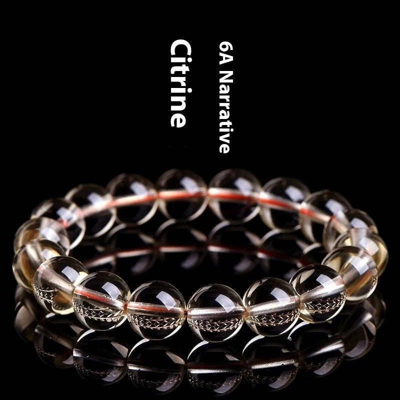 Natural citrine scattered bead bracelet showing polished yellow gemstone beads in an irregular design.