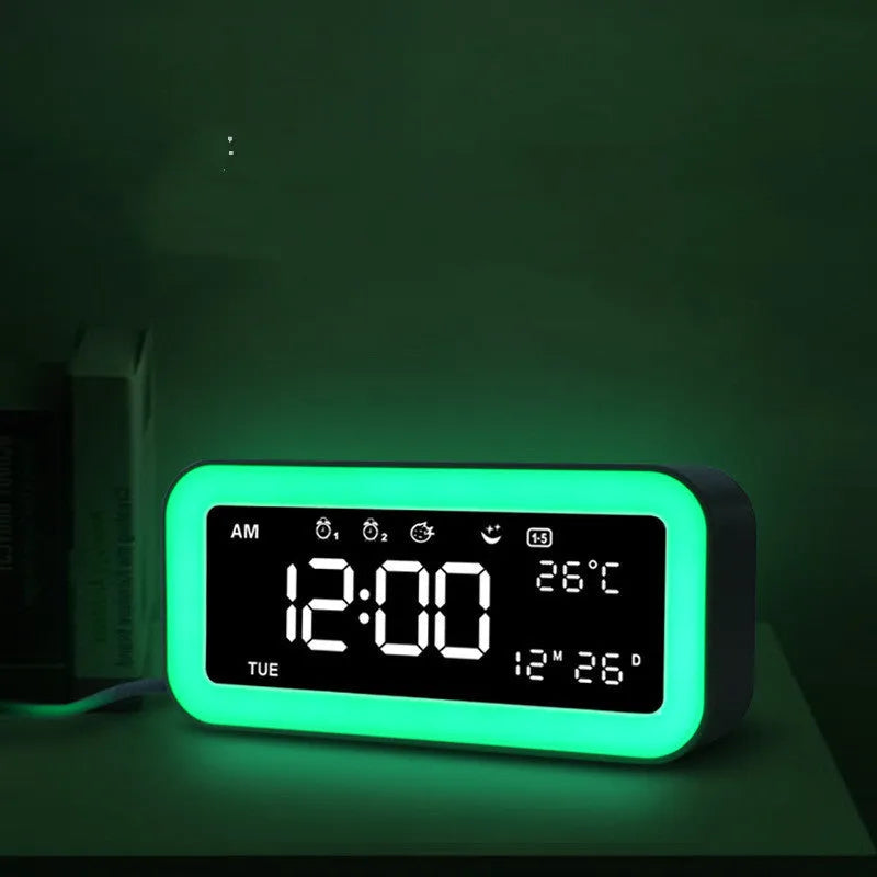 Blue rectangular LED atmosphere light alarm clock with digital display on quartz glass.