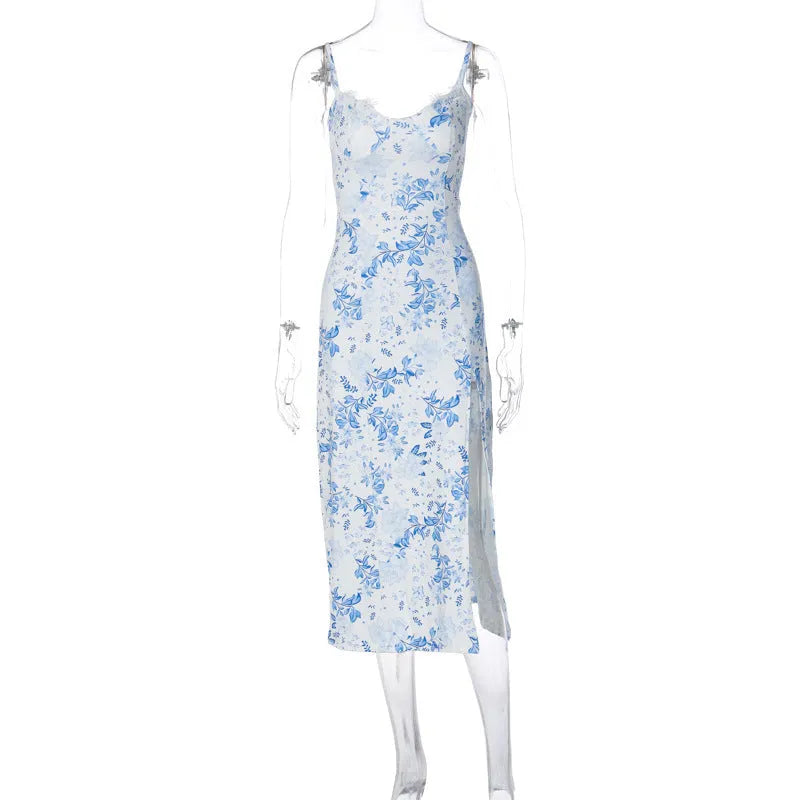 Women's long summer dress with lace flower print, suspender straps, and a high-leg slit.