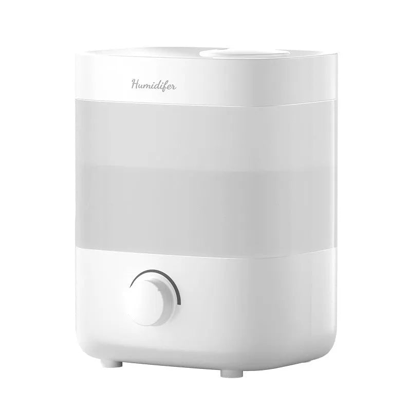 2L white plastic USB humidifier with dual spouts and night light on a desk