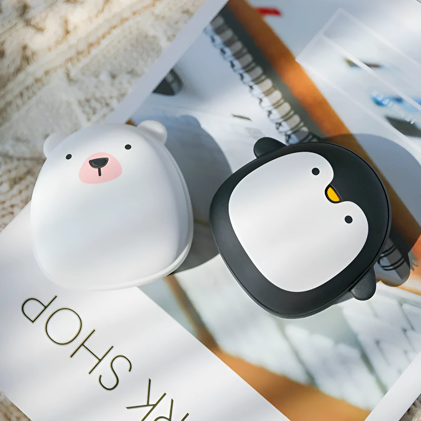 Cartoon penguin polar bear USB rechargeable hand warmer power bank showing black, white, and black-white colour options