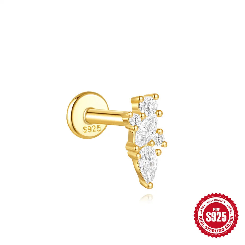 Geometric kite-shaped sterling silver earring with rhinestone head and gold chain tassel.