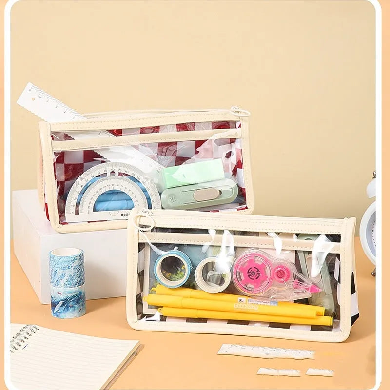 Transparent PVC pencil case with chessboard pattern showing pens inside, 21.5 cm length