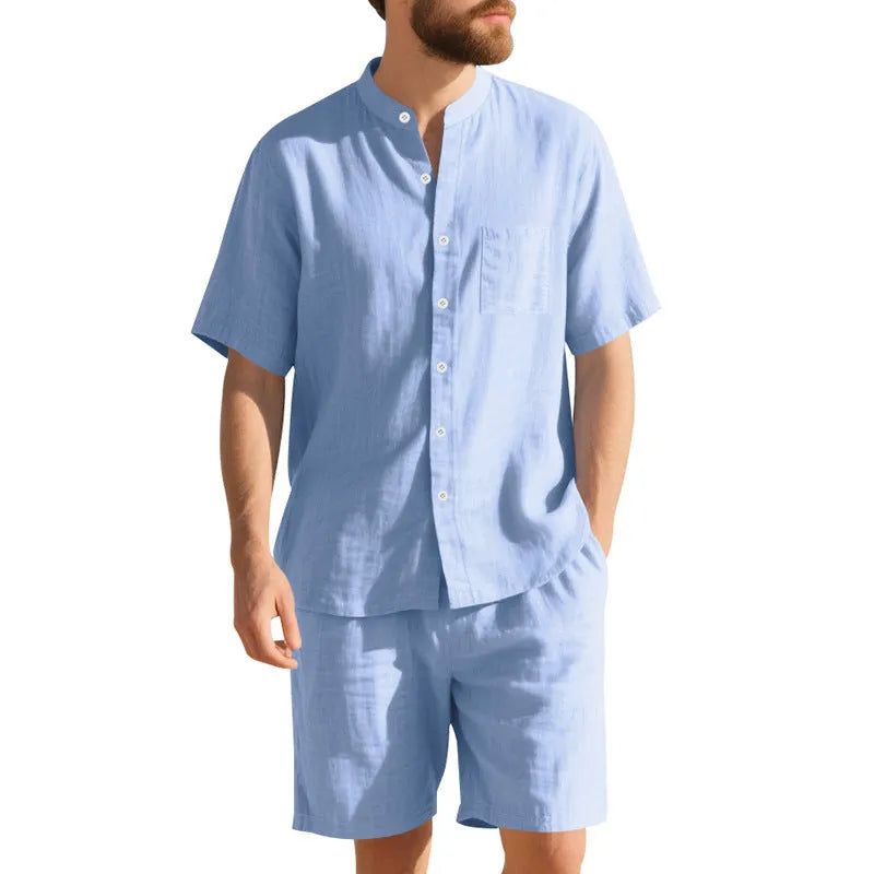 Men's light blue linen blend summer suit with henry collar, short sleeves, and matching shorts