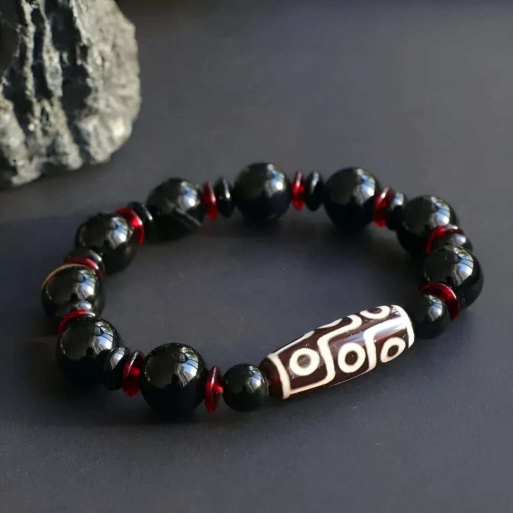 Hand-woven black agate and chalcedony dzi bead bracelet with geometric pattern