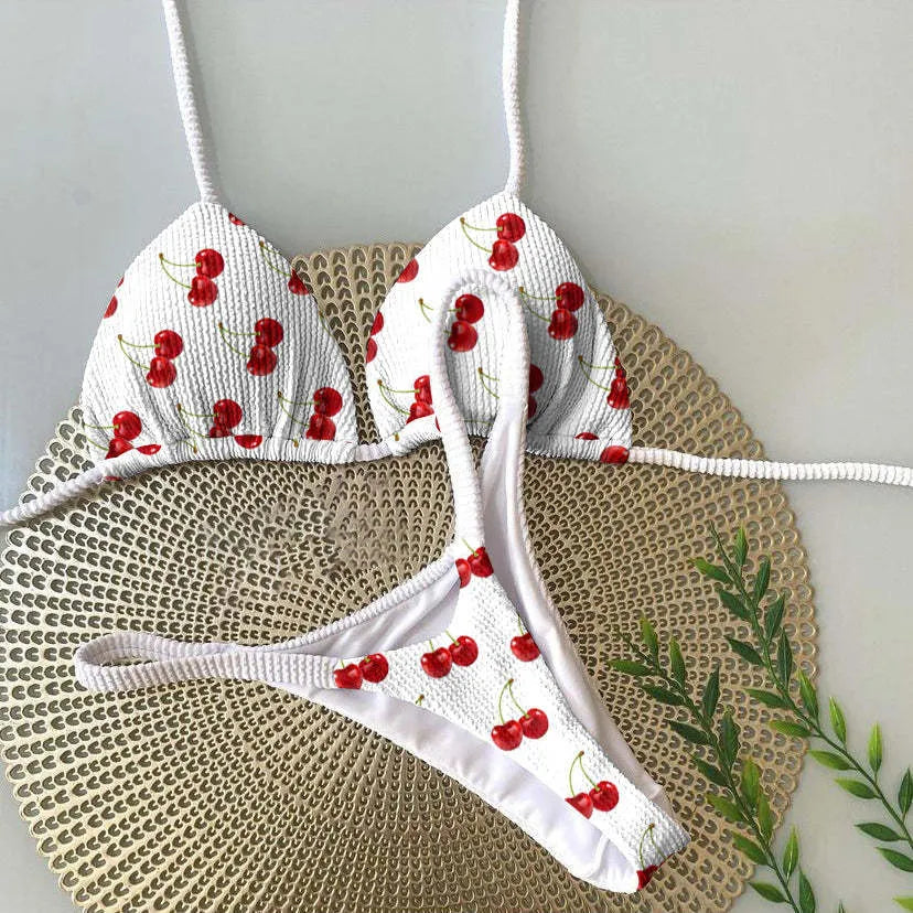 Women's bikini swimsuit with printed fabric in briefs style, showing high elasticity and cotton lining