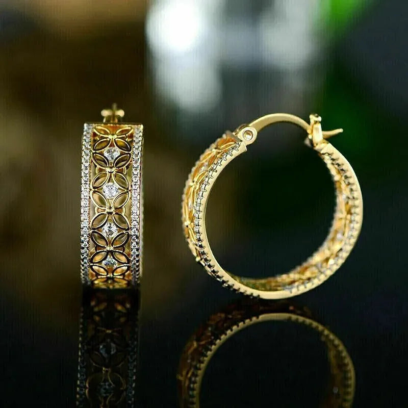 Pair of yellow gold coloured copper ear clips with a geometric horse eye flower butterfly design.