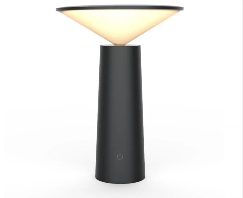 Black USB touch sensor reading lamp with tilted head on a wooden desk
